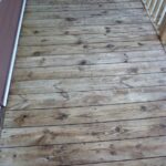 Those same floorboards (now towards the top of photo) look much better after cleaning and brightening with RAD.